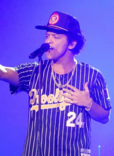 Bruno Mars: This is a photo of American entertainer Bruno Mars performing live during his 24K Magic World Tour