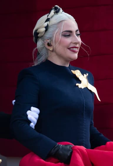 Lady Gaga: Lady Gaga enters the inauguration platform as she prepares to sing a rendition of “The Star-Spangled Banner” at the 59th Presidential Inauguration ceremony in