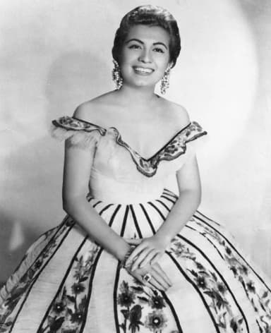 Lola Beltrán: Vintage portrait photo of the famous Mexican singer, LOLA BELTRAN, while posing for the cameras before a performance, dated 1956.