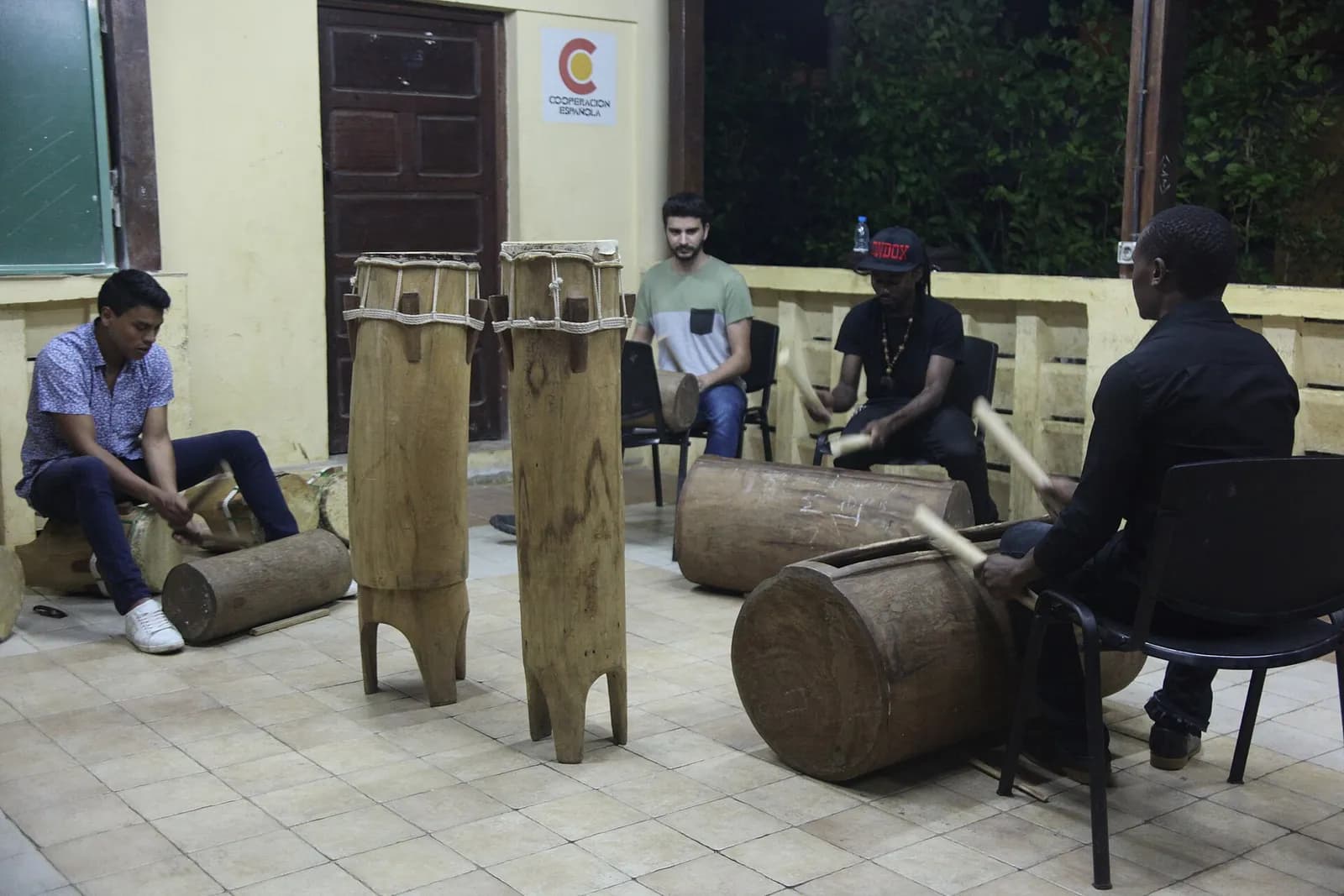 Equatorial Guinea: musicians playing carved wooden drums at a percussion session in Malabo