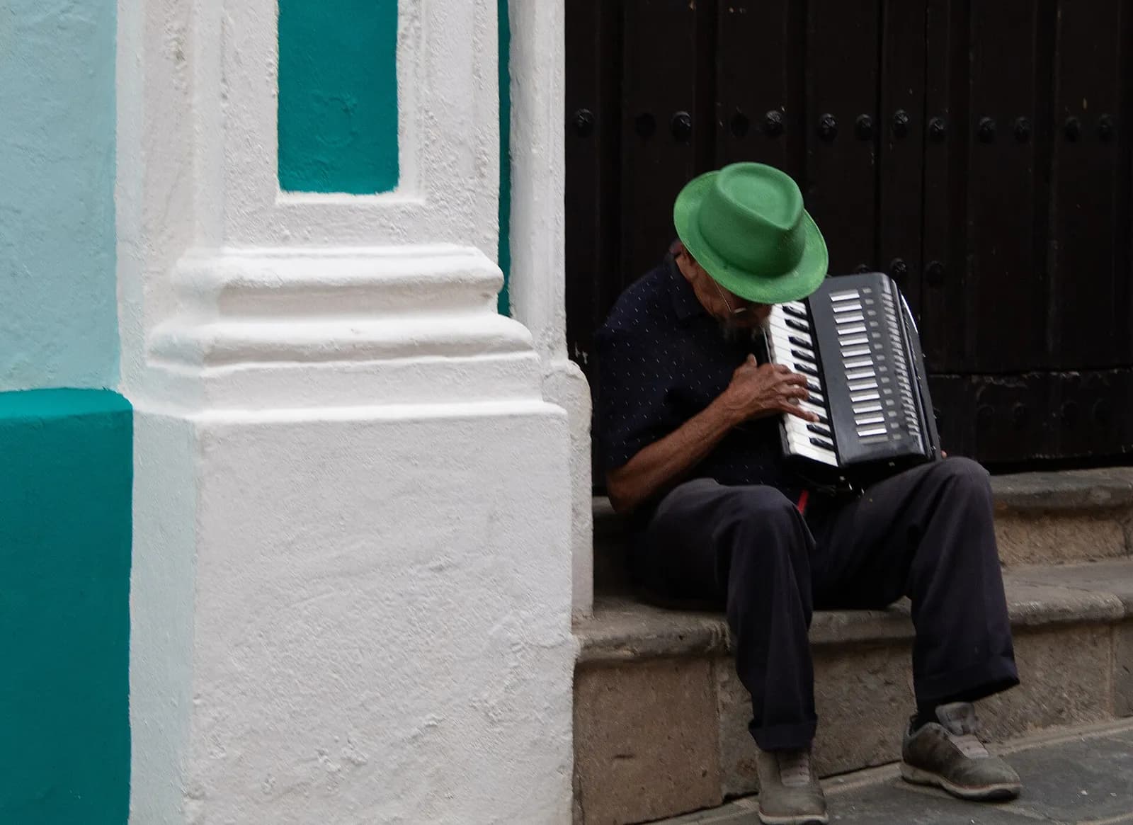 Puerto Rico: Man plays music in Catedral, Old San Juan, Puerto Rico